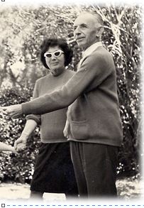 Kurt Loewenstein and his wife Hanna standing in a garden.
